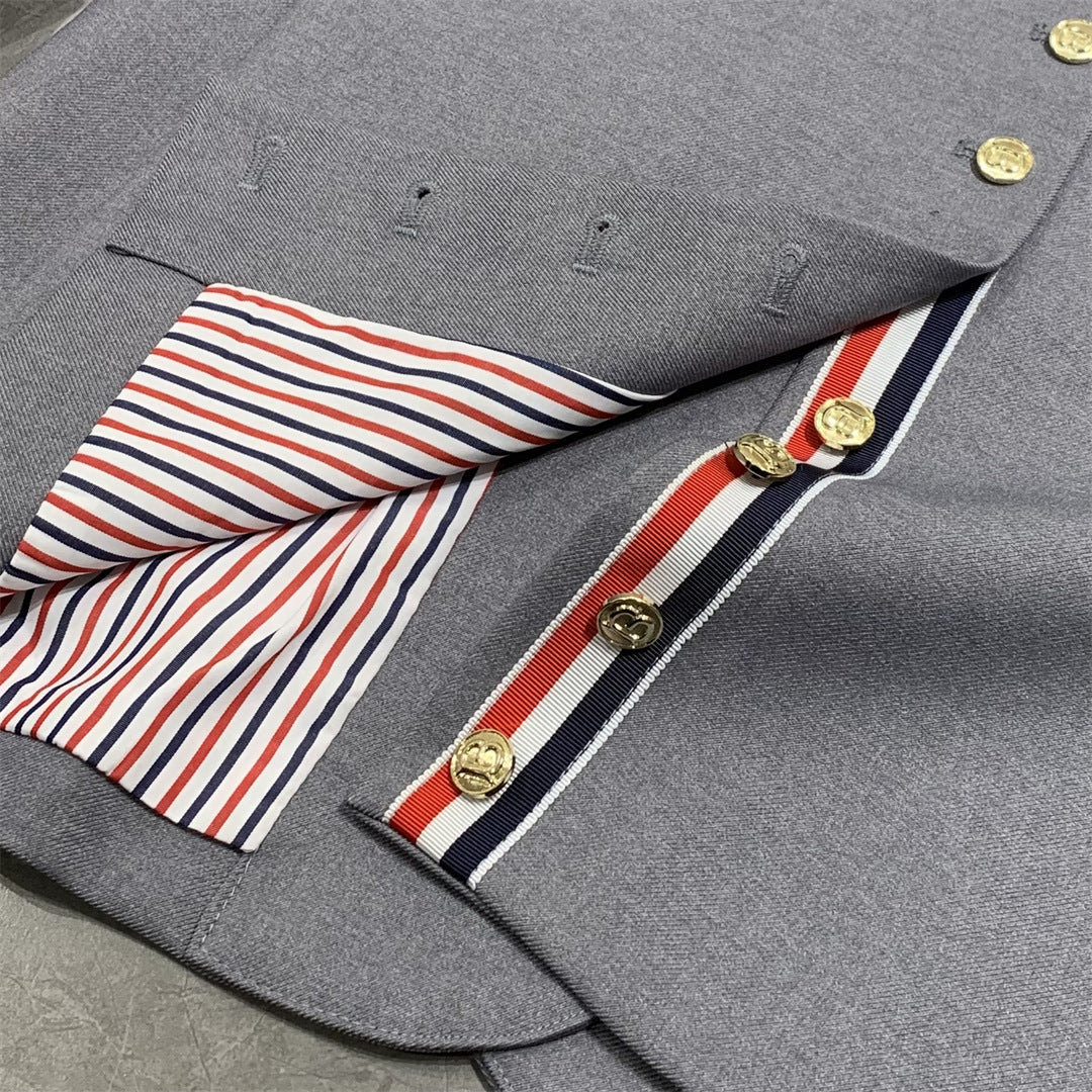 Metal-buttoned suit