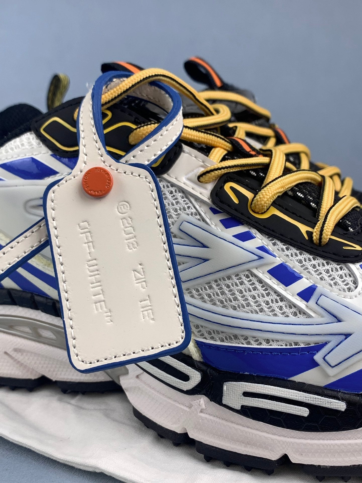 Off White and Blue Sneakers