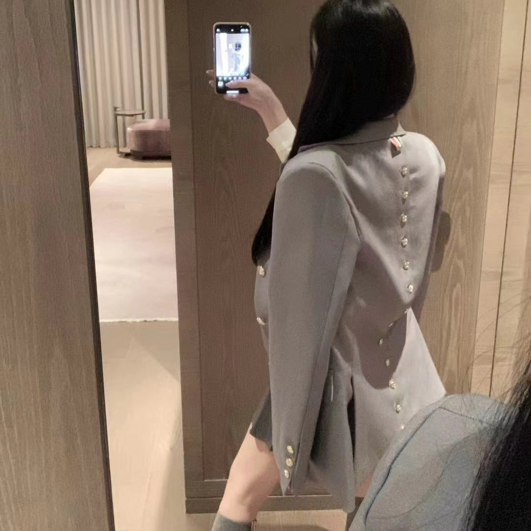 Metal-buttoned suit
