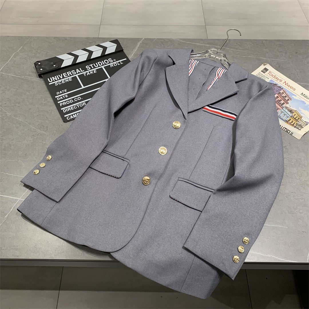 Metal-buttoned suit