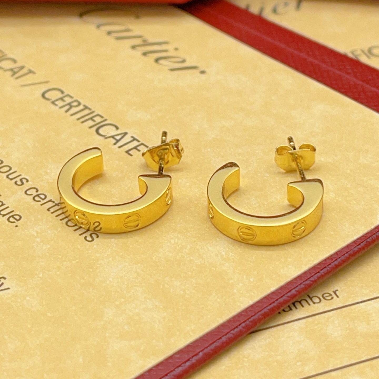 Cartier Polished Gold Stud Earrings
