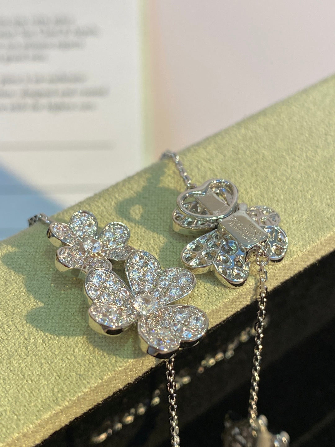an Cleef & Arpels Pavé Diamond Clover Necklace